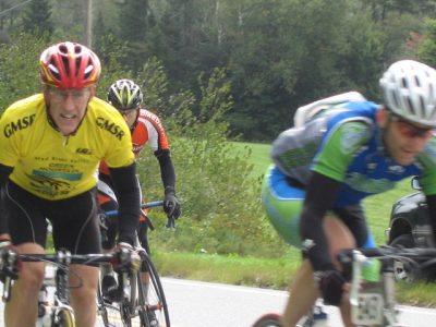 Racers in front of House